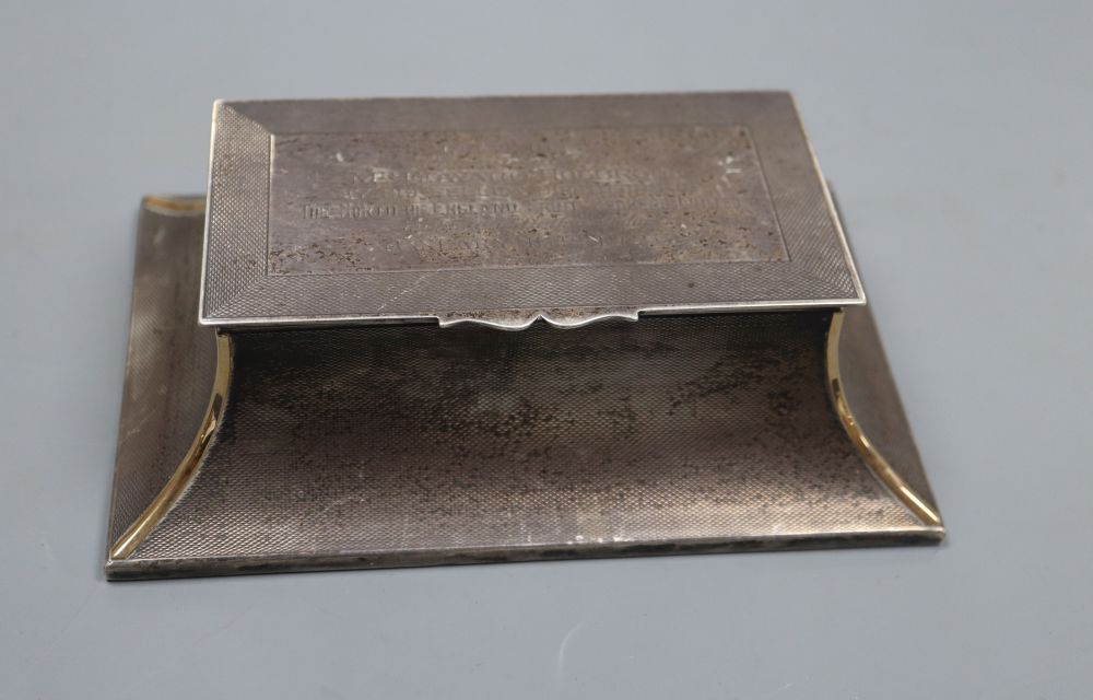 A George V engine turned silver mounted double inkwell, of flared form, with engraved inscription
